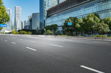 Fototapeta premium Empty road floor surface with modern city landmark buildings of hangzhou bund Skyline,zhejiang,china