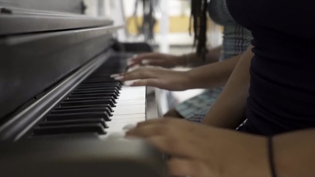 Playing piano with friends in slow motion