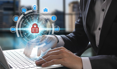 Businessman hand use laptop computer with padlock icon technology