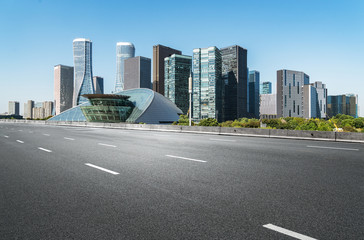Fototapeta na wymiar Empty road floor surface with modern city landmark buildings of hangzhou bund Skyline,zhejiang,china