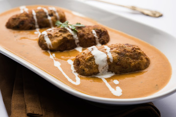 Malai Kofta Curry is a Mughlai special recipe served in a bowl. Selective focus