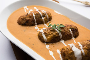 Malai Kofta Curry is a Mughlai special recipe served in a bowl. Selective focus