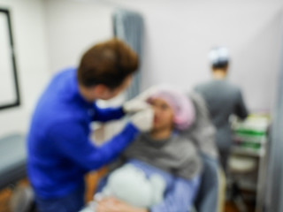 The injection of facial in the clinic, blurred images