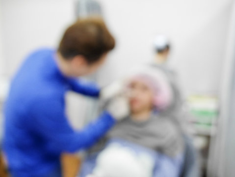 The injection of facial in the clinic, blurred images