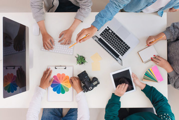 Young creative team having a meeting in creative office - teamwork concepts.