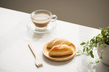 Morning breakfast with bread and coffee.