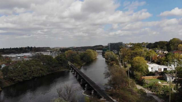 Drone shot over a river and a bridge
