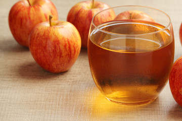 A glass with juice and apples