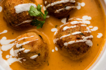 Malai Kofta Curry is a Mughlai special recipe served in a bowl. Selective focus
