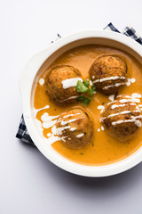 Malai Kofta Curry is a Mughlai special recipe served in a bowl. Selective focus