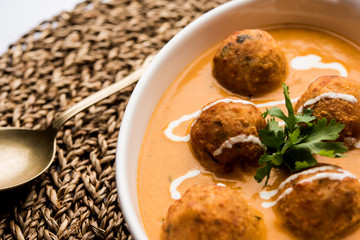 Malai Kofta Curry is a Mughlai special recipe served in a bowl. Selective focus