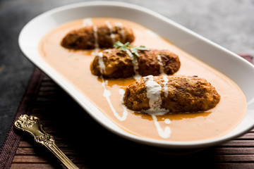 Malai Kofta Curry is a Mughlai special recipe served in a bowl. Selective focus