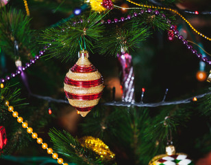 Beautiful original toy whirligig on Christmas tree close-up