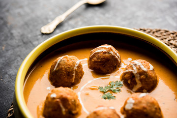 Malai Kofta Curry is a Mughlai special recipe served in a bowl. Selective focus