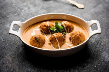 Malai Kofta Curry is a Mughlai special recipe served in a bowl. Selective focus