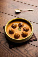 Malai Kofta Curry is a Mughlai special recipe served in a bowl. Selective focus