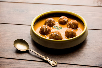 Malai Kofta Curry is a Mughlai special recipe served in a bowl. Selective focus