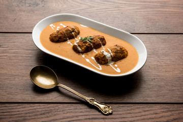 Malai Kofta Curry is a Mughlai special recipe served in a bowl. Selective focus