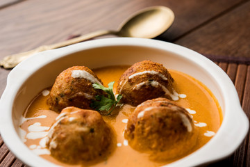 Malai Kofta Curry is a Mughlai special recipe served in a bowl. Selective focus