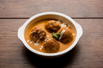 Malai Kofta Curry is a Mughlai special recipe served in a bowl. Selective focus