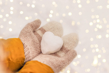 Fototapeta na wymiar Heart of snow. Valentine's Day 