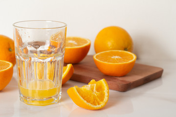 orange juice and oranges close-up.