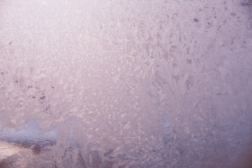 Frosty pattern on the glass, pink color.