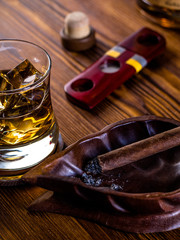 Whisky on the rocks and a cigar