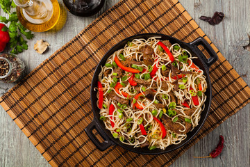 Chinese pasta with beef. Prepared in wok.