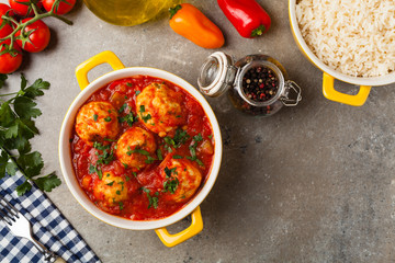 Chicken meatballs with tomato sauce. Served with rice.