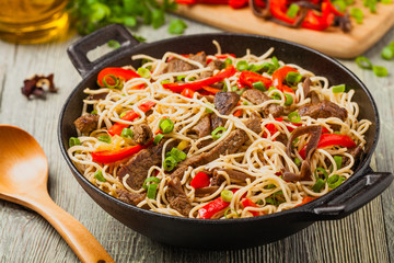 Chinese pasta with beef. Prepared in wok.