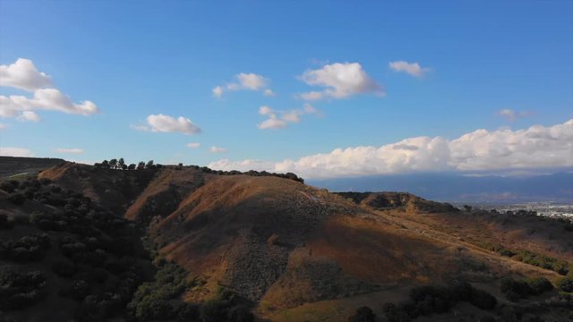 Revolving shot around a hill with the letters LA in red white and blue.