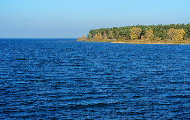 Naklejka premium blue sea with a shore in the distance 2