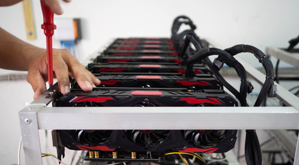 Close up, Tightening screw video card with stainless, For rig miner  bitcoin digital money.