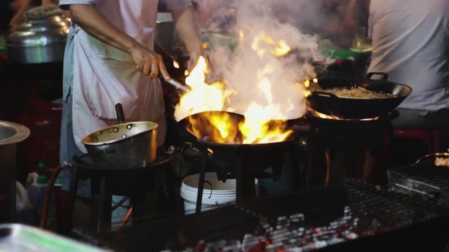 Street foods on Yaowarat road in the evening. Chinatown Bangkok, Thailand
