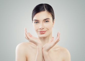 Smiling woman spa model with perfect skin. Facial treatment, spa and skincare concept