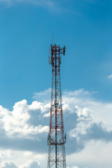 Antenna repeater tower on blue sky.