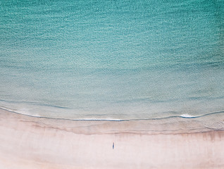 High angle view of lonely man on the Lofoten beach with copy space