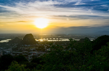 Beautiful sunset in the Marble mountains in Da Nang ,charming view for the city,jungle and...