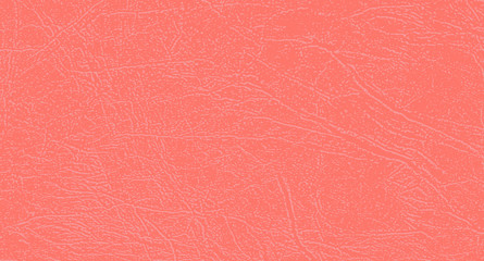 Fototapeta premium Colored skin texture, natural or faux leather background. Light red leatherette, closeup. Cheerful, bright, energetic color of Living Coral. Modern, fashionable color. Perfect place for text.