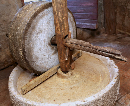 grinding wheel to grind the grain