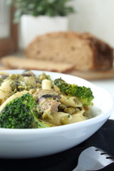 Wheat pasta with vegetables on white bowl -Vertical image.