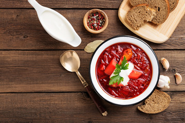 Traditional Ukrainian Russian borscht on wooden table. top view