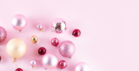 Christmas pink and golden decorations on pink background banner