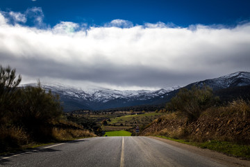 Granada, Spain; November 07, 2018: landscape with road and snowy mountain in the background, in this case Sierra Nevada, Granada