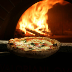 Margherita pizza near the stove