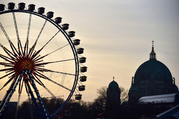 Ferris Wheel in Berlin with booths at the Christmas Fair. © konik60