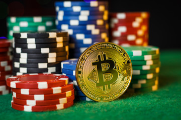 Bitcoin gold coin on the poker table with chips
