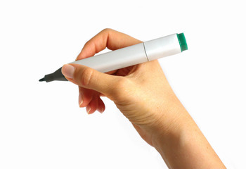 Woman's writing hand, holding green drawing marker pencil, isolated on a white background. Designer's graphic felt pen, macro view.