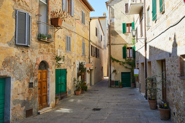 Fototapeta na wymiar Small Old Mediterranean town - lovely Tuscan street in Italy city